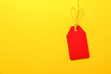 blank price tag on yellow background