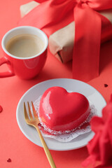 Wall Mural - red heart cake and espresso in small cup for valentines day on red background , copy space