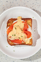 Wall Mural - Portion of brioche breakfast toast with egg and salmon