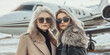 © Oleksandr - Elegant older and younger women posing confidently in luxurious fur coats and sunglasses, with a private jet in the background, symbolizing wealth and travel.
