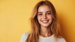 © 2rogan - Smiling young woman with long brown hair in casual attire against a bright yellow background during a job interview in a corporate setting