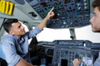© auremar - two men in modern flight simulator for pilot training