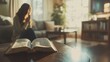 © Volodymyr - young woman praying in a room near an open Bible