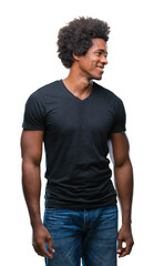 Sticker - Afro american man over isolated background looking away to side with smile on face, natural expression. Laughing confident.