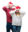 © Krakenimages.com - Young couple in love wearing christmas hat over isolated background suffering from headache desperate and stressed because pain and migraine. Hands on head.