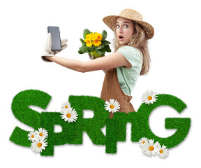 Wall Mural - A amazed woman wearing gardening clothes shows a smartphone, isolated on white background with grass spring text written and daisies flowers. Online gardening shopping for spring and garden work care