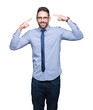 © Krakenimages.com - Young business man wearing glasses over isolated background Smiling pointing to head with both hands finger, great idea or thought, good memory