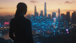 © Teeraphon - Abstract business woman stands on the peak of success amid tall, innovative Smart city and graphs with statistics to analyze business potential and predict future developments in company growth.