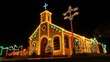 © Atmospheric stock - Vibrant church illuminated with festive christmas lights at night