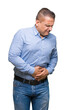 © Krakenimages.com - Middle age arab business man over isolated background with hand on stomach because nausea, painful disease feeling unwell. Ache concept.