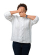 © Krakenimages.com - Beautiful young african american woman wearing sweater over isolated background Covering eyes and mouth with hands, surprised and shocked. Hiding emotion