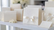 © Yana Zolotova - Classic ivory wedding invitations with embossed designs
