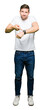 © Krakenimages.com - Handsome man wearing casual white t-shirt In hurry pointing to watch time, impatience, upset and angry for deadline delay