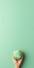 Poster - Minimalist Green Globe in Hand Symbol of Eco-Friendly and Sustainable Living