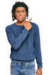 © Krakenimages.com - Young african american man wearing casual winter sweater pointing aside worried and nervous with forefinger, concerned and surprised expression
