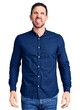 © Krakenimages.com - Young handsome man wearing casual shirt sticking tongue out happy with funny expression. emotion concept.