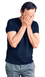 © Krakenimages.com - Middle age handsome man wearing casual t-shirt with sad expression covering face with hands while crying. depression concept.