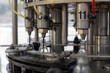 © Marco Reggi/Stocksy - Bottling machine filling plastic bottles in a production line