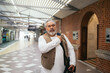 © Pedro Merino/Stocksy - senior man on his way to work