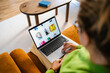 © DZ FILM/Stocksy - A woman uses a laptop at home