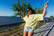 © Ana Luz Crespi/Stocksy - Fun latina woman skating and dancing at the park portrait