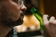 © DZ FILM/Stocksy - A man drinks beer