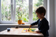 © Lilith Matevosyan/Stocksy - Boy Playing Kinetic Sand