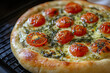 © Prime Lens - Beautiful pizza with tomatoes and basil fresh out of a wood-fired oven