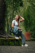 © Saddha Visual - Happy Woman in Casual Outfit Enjoying a Peaceful Forest Setting Outdoors