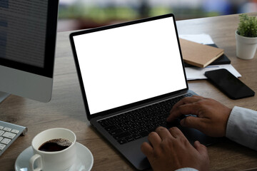 Wall Mural - man working businessman using a desktop computer of the blank screen with hands