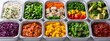 © Exnoi - A row of trays with a variety of food items including vegetables and fruits