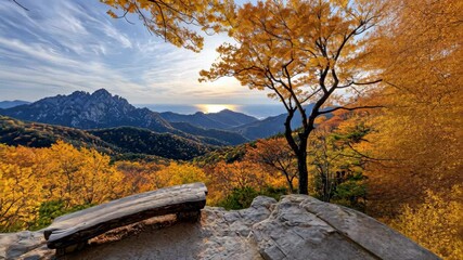 Wall Mural - Serene autumn landscape featuring vibrant foliage, mountains, and stunning sunset view