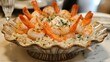 © Puttipong - A seafood risotto with shrimp and scallops served in a decorative bowl.