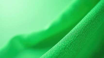 Fototapete - Close-up of Vibrant Green Fabric Texture with Soft Drape and Subtle Texture