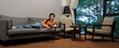 © SHOTPRIME STUDIO - Cozy indoor reading scene with a young woman in casual orange attire enjoying a book on a comfortable gray sofa in a serene setting