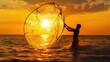 © Pannee - A fisherman casting a large circular net into the ocean under a golden sunset.