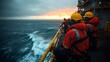 © Bos Amico - Offshore oil rig workers in safety gear relaxing on the rig platform