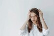 © Rawpixel.com - Stressed woman holding head