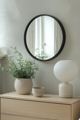 Wall Mural - a scandinavian bedroom corner with a light wooden sideboard and a round mirror