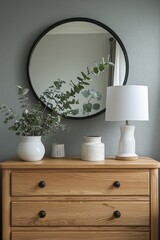 Wall Mural - a scandinavian bedroom corner with a light wooden sideboard and a round mirror