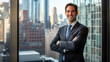 © Phudit - Professional man in smart suit standing confidently by large window with city skyline view, embodying success and modern business environment