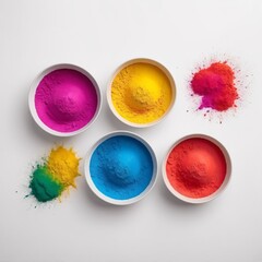 top view of colorful traditional holi powder in bowls isolated on white