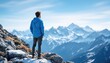 © Vancouver - Young caucasian male exploring snow-capped mountain range on a clear day