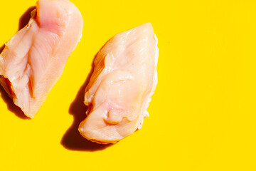 Uncooked raw chicken  breast fillets on white background.