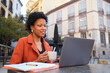 © Cavan Images - Businesswoman working remotely enjoying a coffee in Madrid, Spain