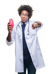 Wall Mural - Afro american cardiologist doctor man over isolated background pointing with finger to the camera and to you, hand sign, positive and confident gesture from the front