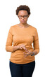 © Krakenimages.com - Young beautiful african american woman wearing glasses over isolated background depressed and worry for distress, crying angry and afraid. Sad expression.