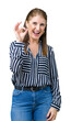 © Krakenimages.com - Middle age mature business woman over isolated background smiling positive doing ok sign with hand and fingers. Successful expression.