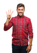 © Krakenimages.com - Young handsome man over isolated background showing and pointing up with fingers number four while smiling confident and happy.