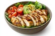 © LimeSky - Grilled chicken with a fresh salad of tomatoes avocados lettuce and spinach Healthy detox friendly Buddha bowl for a ketogenic diet on a white background